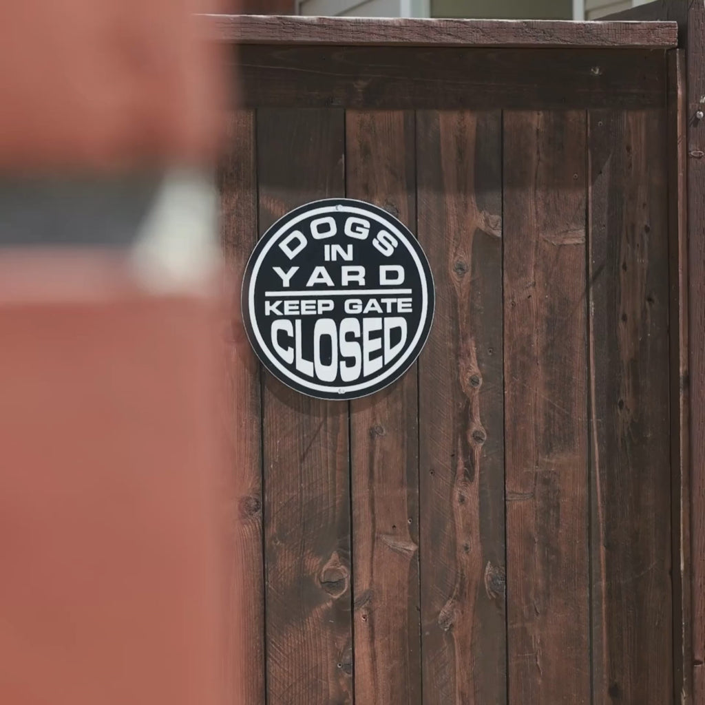 Circular Aluminum Dogs in Yard Keep Gate Closed Sign